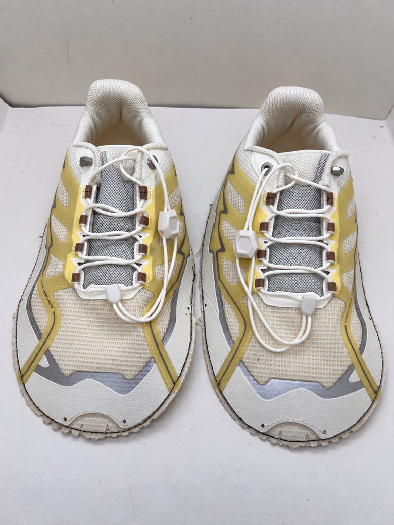 Cream mesh upper with gold overlays and toggle laces