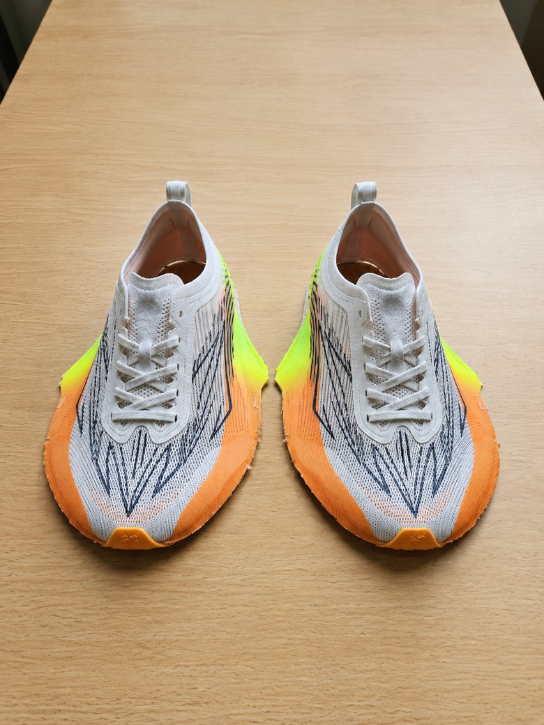 Grey knit upper with orange and neon-yellow overlays